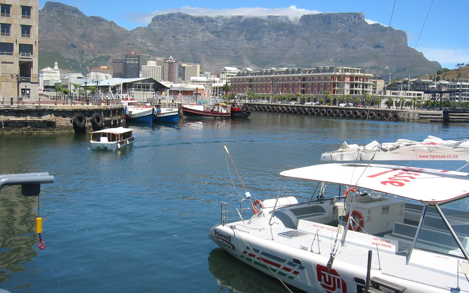 A waterfront with Table Mountain visible in the distance